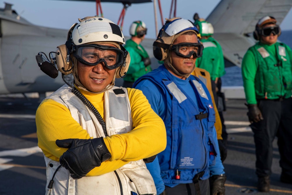 USS Arlington Sailor Observes Flight Operations