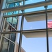 The American Flag is reflected in the efficiency glass used in the new Army Aviation Readiness Center for the South Dakota National Guard.