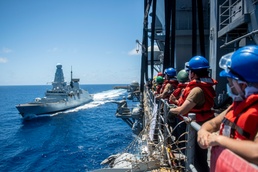 Sailors assigned to the forward deployed amphibious assault ship USS America participate in a fueling-at-sea.