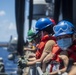 Sailors assigned to the forward deployed amphibious assault ship USS America participate in a fueling-at-sea.