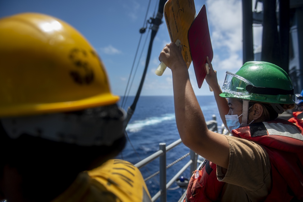 Sailors assigned to the forward deployed amphibious assault ship USS America participate in a fueling-at-sea.
