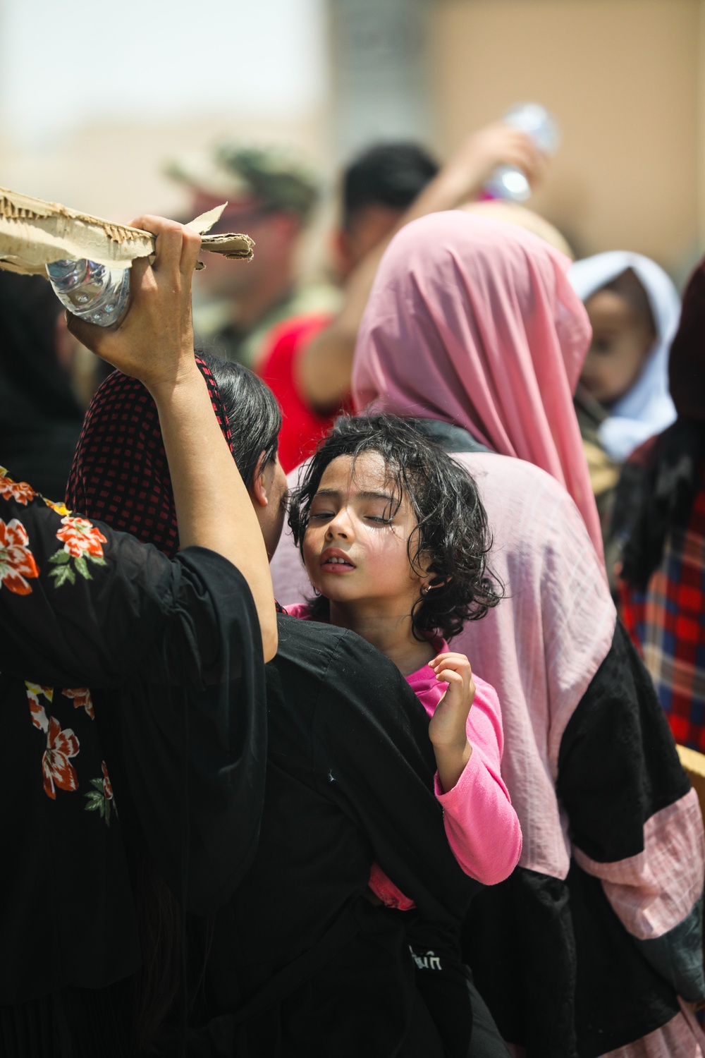 Soldiers assist with the evacuation at Hamid Karzai International Airport