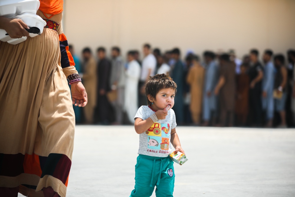 Soldiers assist with the evacuation at Hamid Karzai International Airport