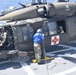 USNS Burlington Sailor Secures a UH-60 Blackhawk Helicopter