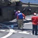 USNS Burlington Sailors Refuel a UH-60 Blackhawk Helicopter