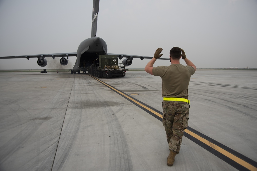 366th LRS and 21st AS offloads cargo from a C-17