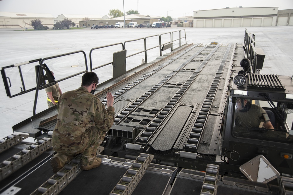 366th LRS and 21st AS offloads cargo from a C-17