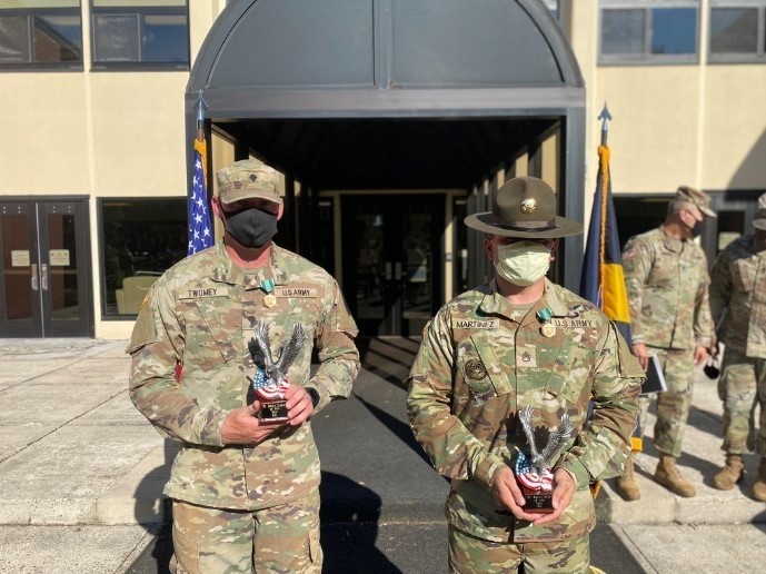 Staff Sgt. Juan Martinez and Spc. Joseph Twomey received their trophies for Fort Eustis Best NCO and Soldier of the Year