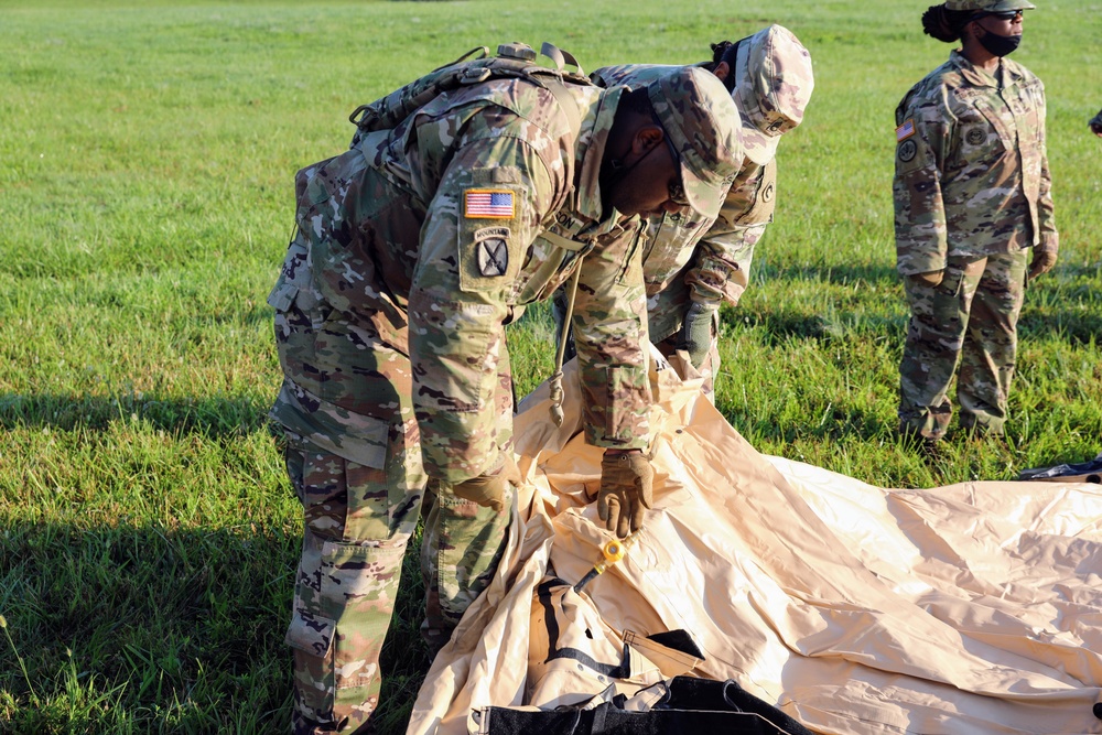 1st Theater Sustainment Commmand Soldiers set up airbeam tent