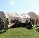 1st Theater Sustainment Commmand Soldiers set up airbeam tent