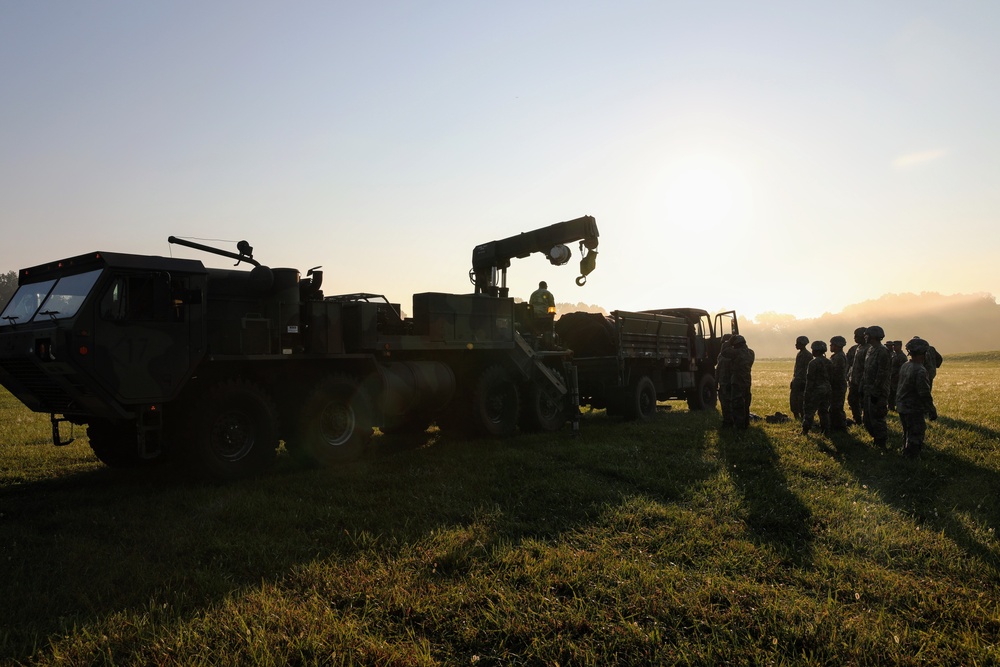 1st Theater Sustainment Commmand Soldiers set up airbeam tent