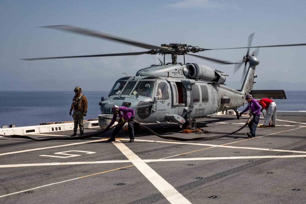 USS Arlington Sailors Refuel an HSC 28 Seahawk Helicopter