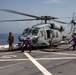 USS Arlington Sailors Refuel an HSC 28 Seahawk Helicopter