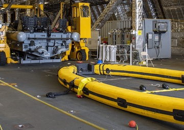 USS Jackson (LCS 6) Sailors perform maintenance on surface tow cradle
