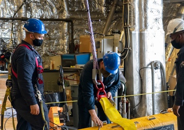 USS Jackson (LCS 6) Sailors perform maintenance on surface tow cradle