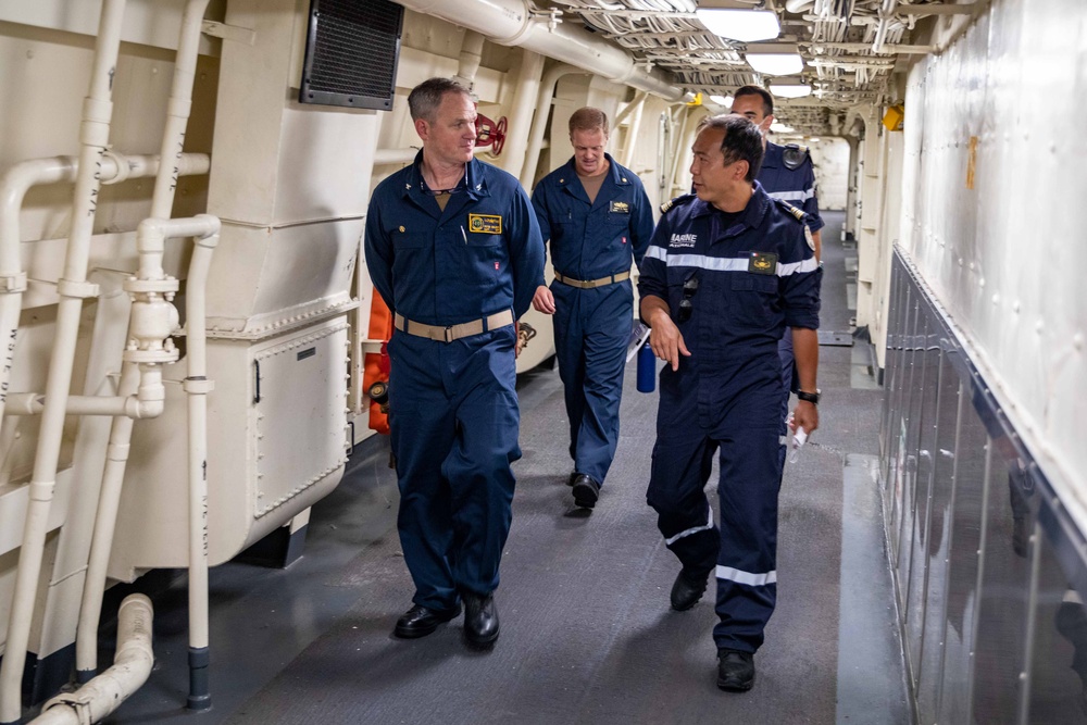 U.S. and French Navy Captains Converse While Touring USS Arlington