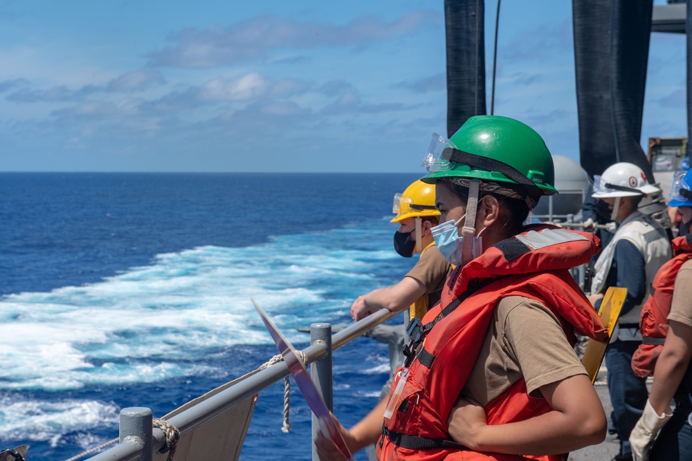 USS America conducts a fueling-at-sea with USS Charleston