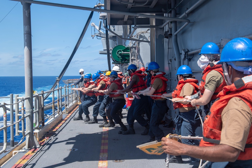 USS America conducts a fueling-at-sea with USS Charleston