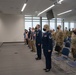 Airmen stand at attention during Master Sgt. Selena Tatum's promotion to Senior Master Sergeant