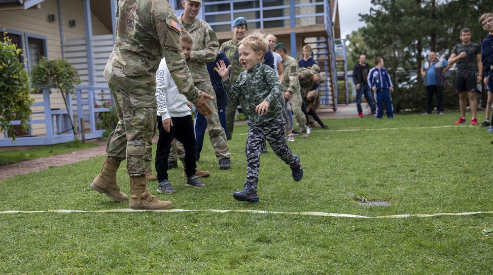 Burt's Knights and NATO Partners volunteer at orphanage