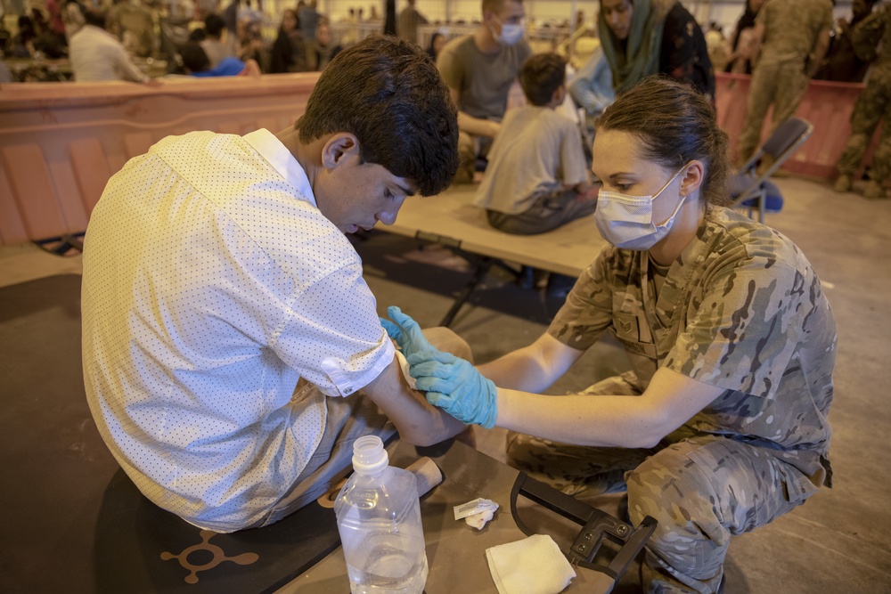 Service members and civilians provide support for Afghanistan evacuation
