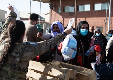 82nd Paratrooper Distributes Bags of Baby Supplies to Evacuating Families
