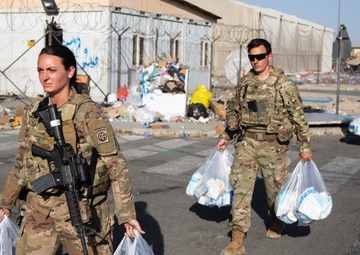 Soldiers Move Packaged Care Bags to Deliver to Evacuating Families