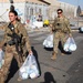 Soldiers Move Packaged Care Bags to Deliver to Evacuating Families