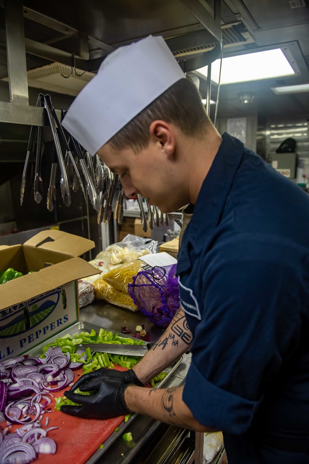 Sailor Prepares Meal Aboard USS Michael Murphy (DDG 112)
