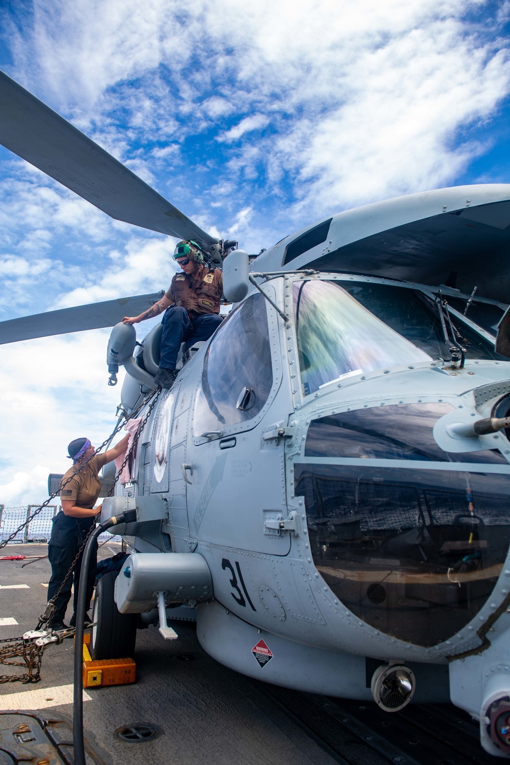 Sailors Conduct Maintenance on an MH-60R Seahawk Aboard USS Michael Murphy (DDG 112)