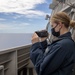 USS Jackson (LCS 6) Sailor stands watch on bridge wing