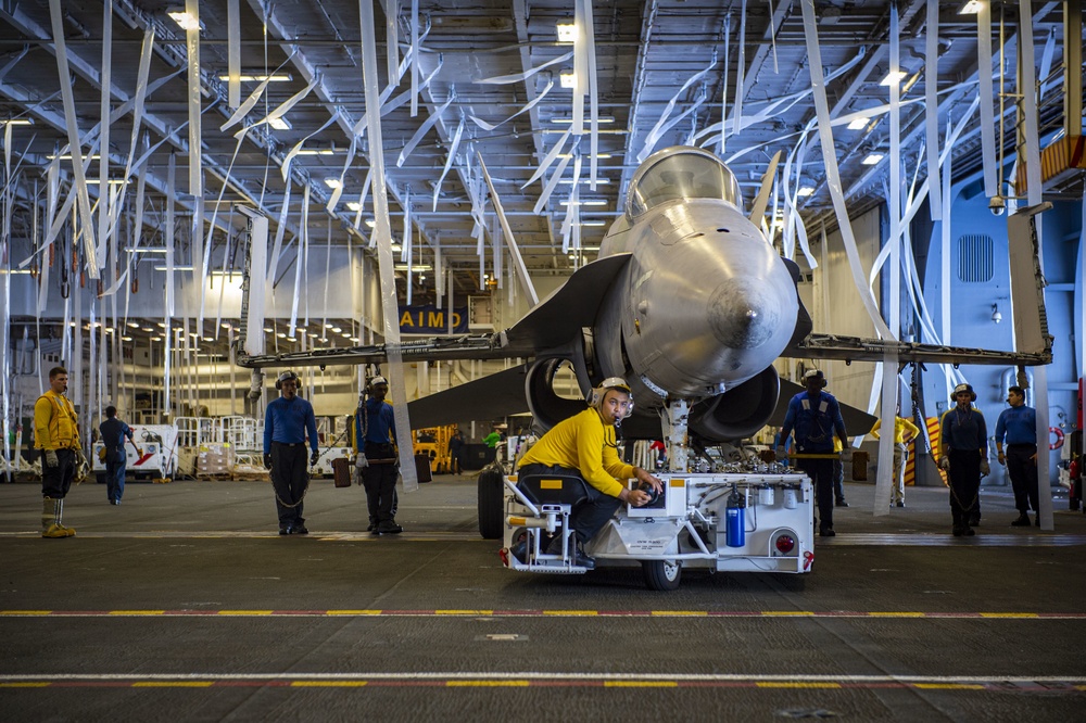 GHWB Sailor Moves a Training Aircraft