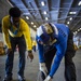 GHWB Sailors Move a Training Aircraft