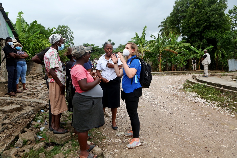 USAID Assistant Administrator Charles speaks with resident of Maniche, Haiti after 7.2 earthquake