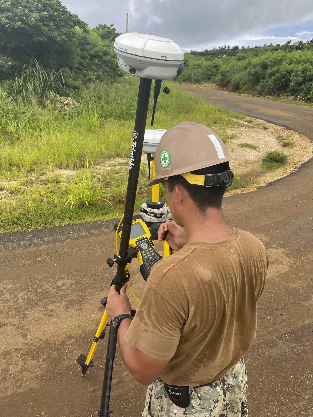 US Navy Seabees assigned to NMCB-5 pave and repair roadways in Tinian, Northern Mariana Islands