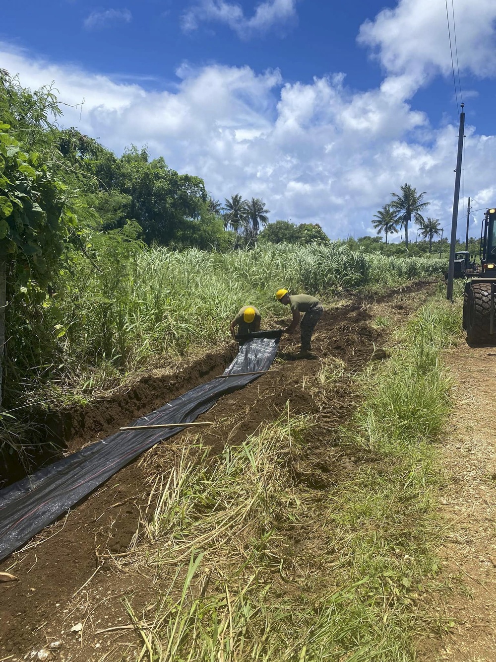 US Navy Seabees assigned to NMCB-5 pave and repair roadways in Tinian, Northern Mariana Islands