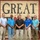2021 Army Strong Bonds for Kentucky National Guard Seven men are posing together in front of a large wooden sign that reads 'GREAT' with additional partially obscured text below. The group appears to be at an outdoor venue or attraction, likely for a group photo commemorating a visit or event. The setting is outdoors with green grass and trees visible in the background.