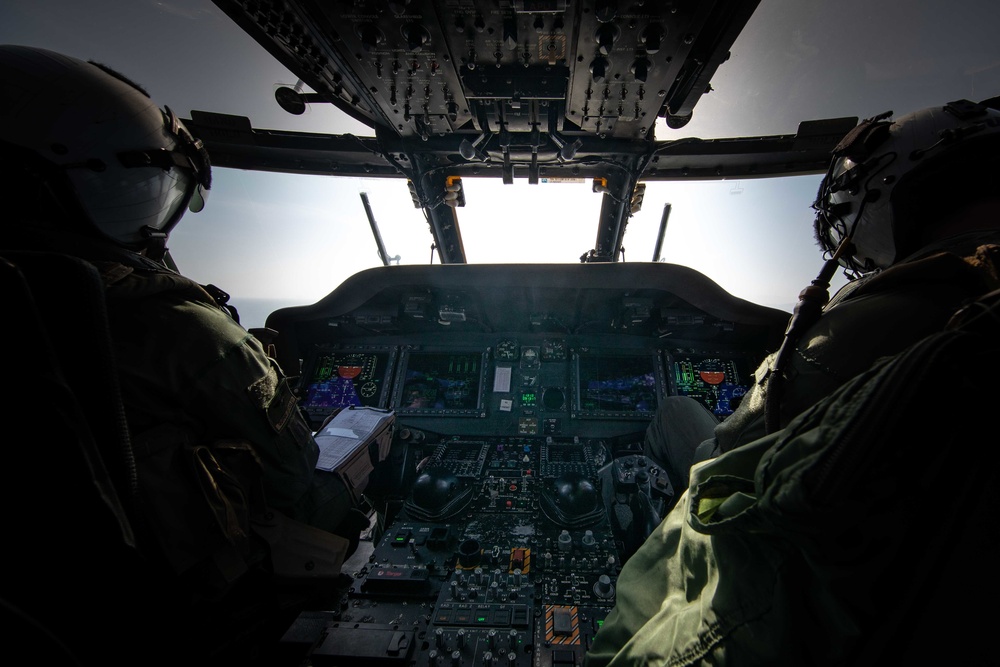HSC-28 Pilots Fly An MH-60S Sea Hawk Helicopter Into Haiti To Support A Humanitarian Aid Mission