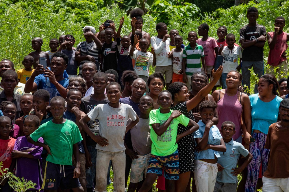 Haitians Gather To Receive Humanitarian Aid