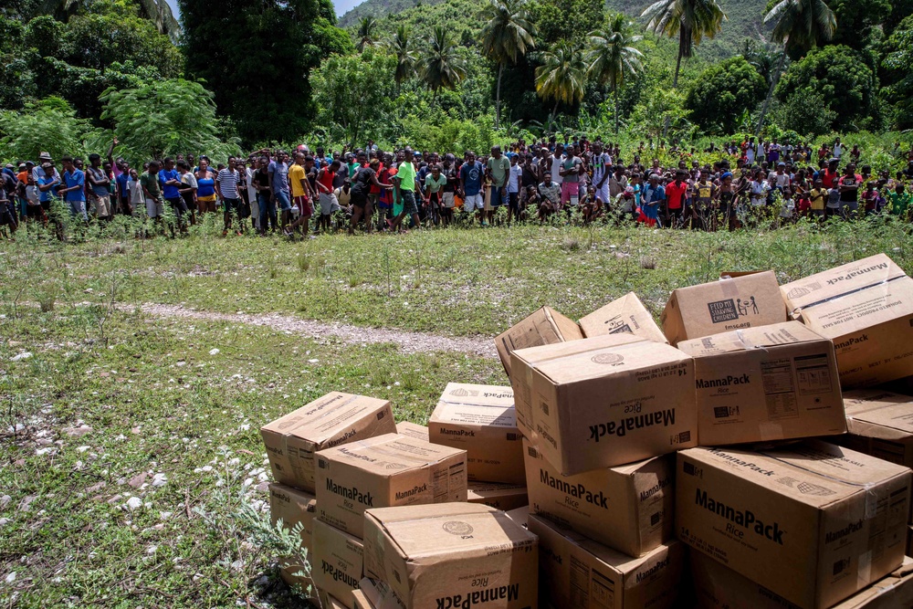 Haitians Gather To Receive Humanitarian Aid