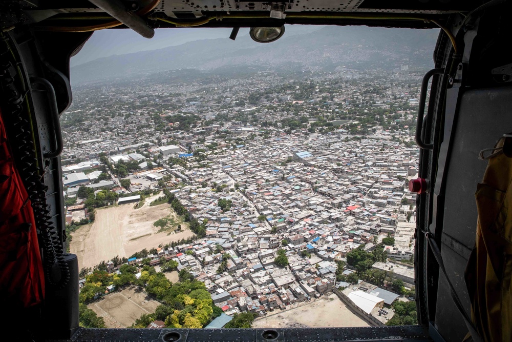 An MH-60S Sea Hawk Helicopter Flies Over Haiti To Support The Humanitarian Aid Mission