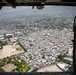 An MH-60S Sea Hawk Helicopter Flies Over Haiti To Support The Humanitarian Aid Mission