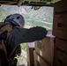 HSC-28 Aircrewman Prepares To Deliver Humanitarian Aid In Haiti