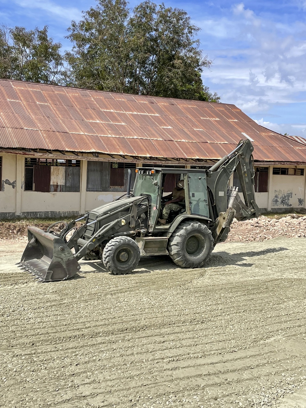 US Navy Seabees with NMCB-5 build a schoolhouse in Timor-Leste to support the local Ministry of Education