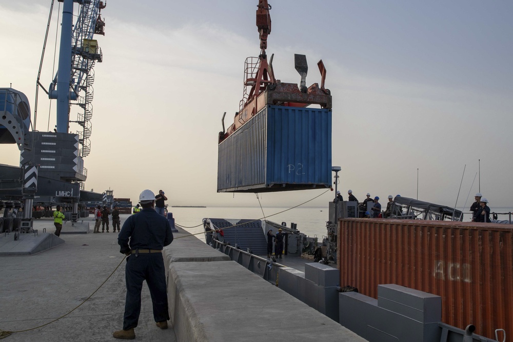 Sailors Load Shipping Container Of Humanitarian Aid Onto A U.S. Navy LCU