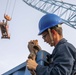 Sailor Secures A Shipping Container of Humanitarian Aid