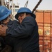 Sailors Secure A Shipping Container Of Humanitarian Aid On A U.S. Navy LCU