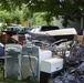 Flood Debris Moved to Edge of Street