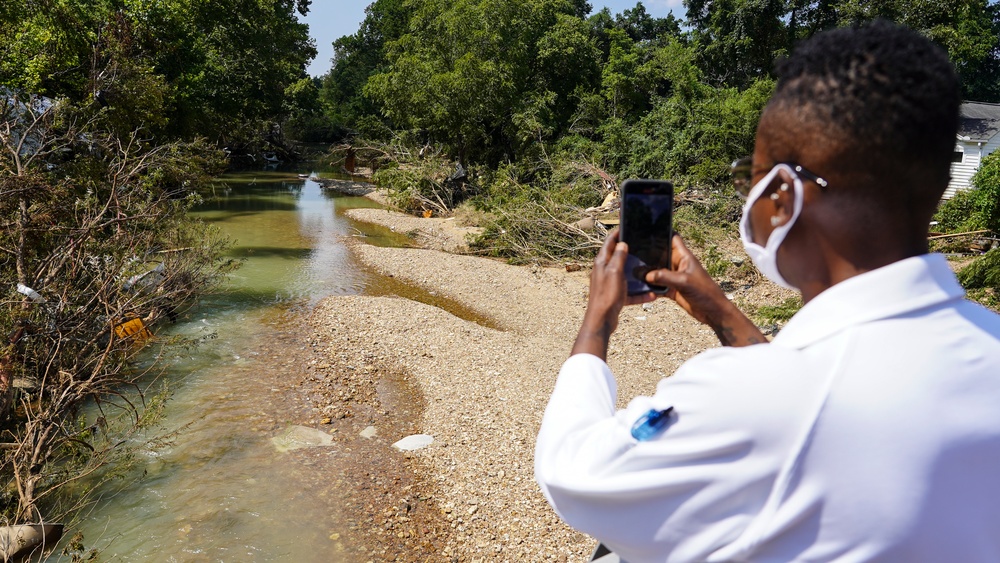 FEMA Federal Coordinating Officer Shird Takes Photo of Creek