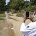 FEMA Federal Coordinating Officer Shird Takes Photo of Creek